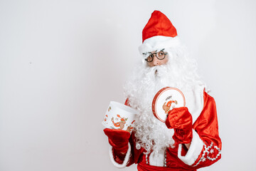 Close-up portrait of Santa Claus holding Christmas present.