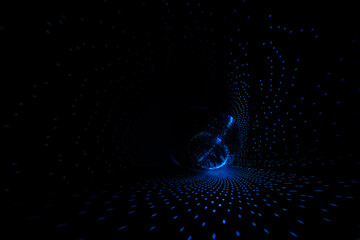 Rays of bright blue light on the floor and walls. Disco ball reflecting light in a dark hall for...