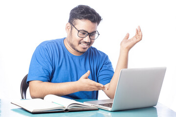 happy man talking over video chat on laptop