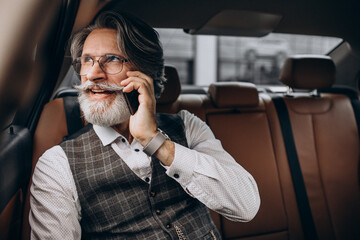 Business man sitting in his car at the back sit