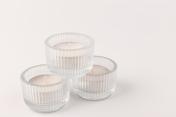 Many wax candles together on the white background
