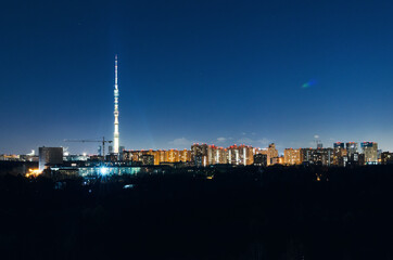 Naklejka premium RUSSIA, MOSCOW: Scenic night landscape view of the city garden with Ostankino tower