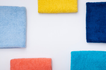 Composition of colored cotton towels. The concept of softness and purity