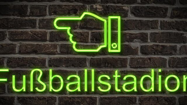 Detailansicht einer Leuchtreklame an einer Mauer mit der Aufschrift Fu&szlig;ballstadion