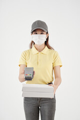 Young woman working as a courier, delivering pizza and accepting payment