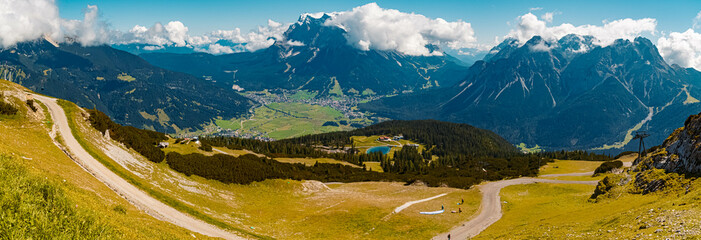 High resolution panorama of an alpine summer view with the famous Zugspitze summit in the...