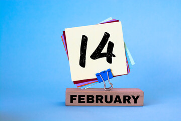 Fototapeta premium February 14th. Day 14 of February month, calendar on blue workplace background. Winter time
