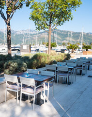 Empty chair and table with outdoor view. Tivat Porto Montenegro
