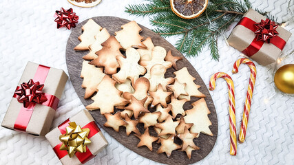 Christmas pastries in the form of stars, ginger men on the table. winter holiday