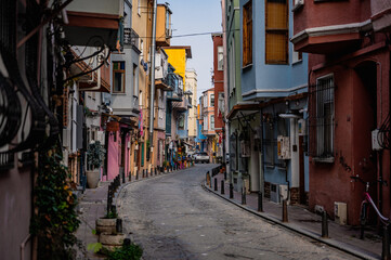 Fototapeta na wymiar Istanbul, Turkey - November 08, 2021: Balat district of Istanbul. very popular Multicolored houses in row on the street in Istanbul