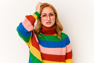 Young caucasian woman wearing a sweater with stripes isolated on white background being shocked, she has remembered important meeting.