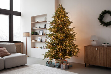 Stylish christmas living room interior with christmas tree, wreath, gifts and decoration. View of modern style interior with xmas decor. Template.