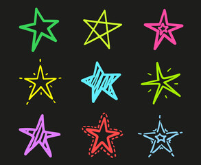 Hand drawn abstract colored stars on isolated black background. Freehand elements. Colorful illustration
