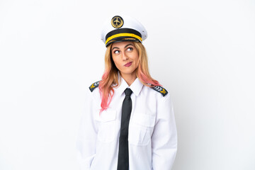 Airplane pilot over isolated white background and looking up