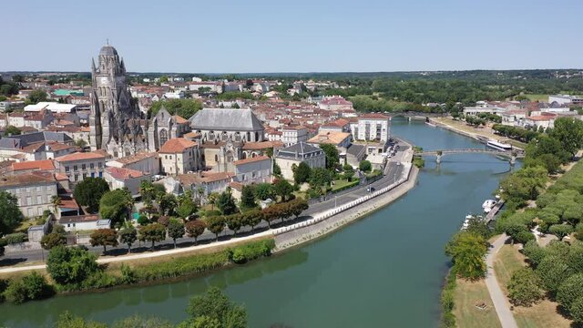 Scenic view from drone of historic district of Saintes town overlooking Flamboyant Gothic cathedral of St. Peter in summer, France