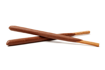 Breadsticks covered with chocolate on white background