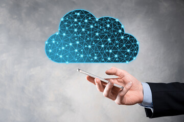 Businessman hold cloud icon.Cloud computing concept - connect smart phone to cloud. computing...