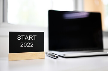 Start 2022 business idea, action concept. on desk background
