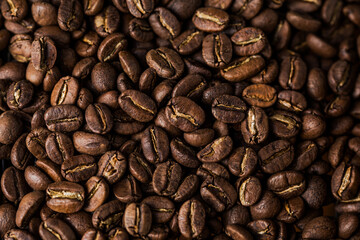Coffee beans texture or coffee background. Fragrant fried bean  a-smoke.