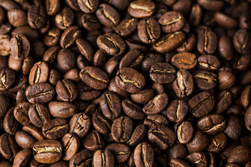 Coffee beans texture or coffee background. Fragrant fried bean  a-smoke.