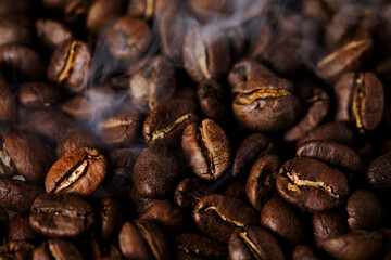 Coffee beans texture or coffee background. Fragrant fried bean  a-smoke.