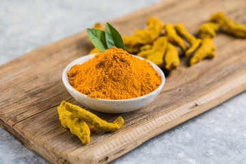 Indian turmeric powder and root. Turmeric spice.