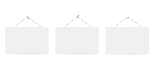 Three blank white boards for messages or photo hanging on ropes.