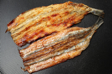 Dried fish slice on white background