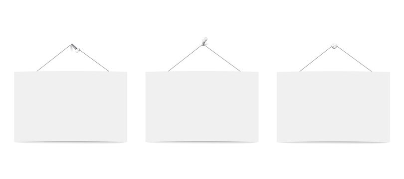 Three blank white boards for messages or photo hanging on ropes.