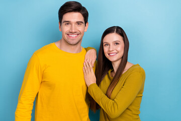 Obraz premium Photo of cheerful romantic couple cuddle posing wear yellow casual outfit isolated blue color background