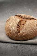 Rye bread on a grey napkin on a grey marble background