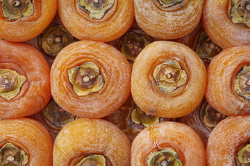 Top down view of dried persimmon fill the frame 