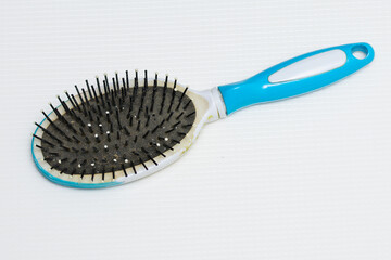 a woman's blue comb 