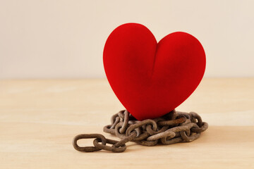 Heart on iron chain - Concept of love and freedom