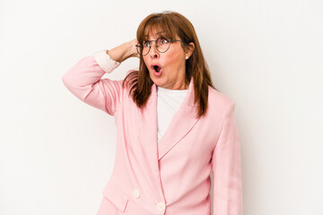 Middle age caucasian woman isolated on white background being shocked, she has remembered important meeting.