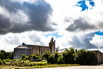 Fototapeta na wymiar Vintage industrial old plant with steel silo
