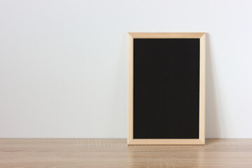 wooden frame with black background on the table