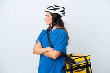Young delivery woman with thermal backpack isolated on white background in lateral position
