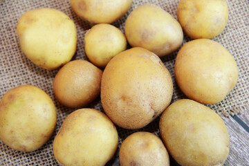 round fruits of fresh yellow potatoes