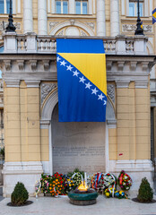 Bosnian flag and wreaths around  Eternal flame for  Independence Day