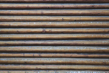 Blockhouse wall, parallel wooden logs, wooden hut