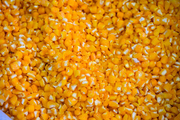 Dry groats in bulk in a bag close-up: corn