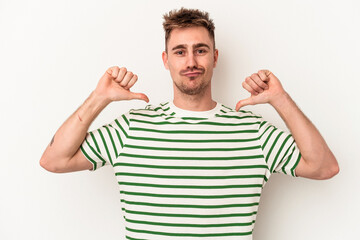Fototapeta premium Young caucasian man isolated on white background feels proud and self confident, example to follow.