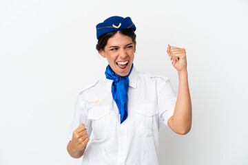 Airplane stewardess caucasian woman isolated on white background celebrating a victory