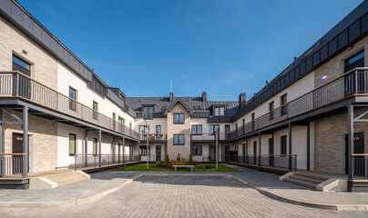 Yard of luxury residential townhouse. Modern architecture.