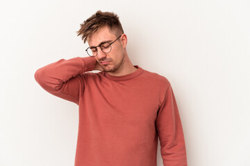 Young caucasian man isolated on white background having a neck pain due to stress, massaging and touching it with hand.