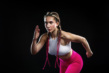 Aduld fit girl in the sportswear, woman sprinter, running on black background with copy space. Fitness, sport, runner, motivation concept.