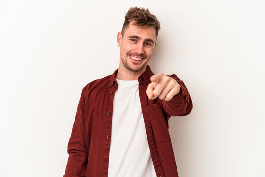 Young caucasian man isolated on white background cheerful smiles pointing to front.