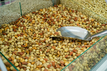 Various types of nuts in the assortment in bulk in bulk in the store