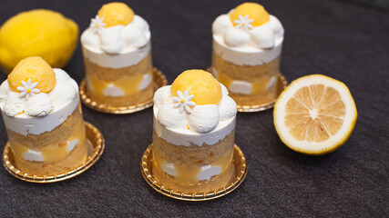 Lemon layer cake with lemon curd and fresh cream decorated like daisy flower